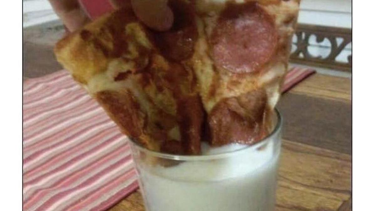 People are dunking pizza in milk. No joke.