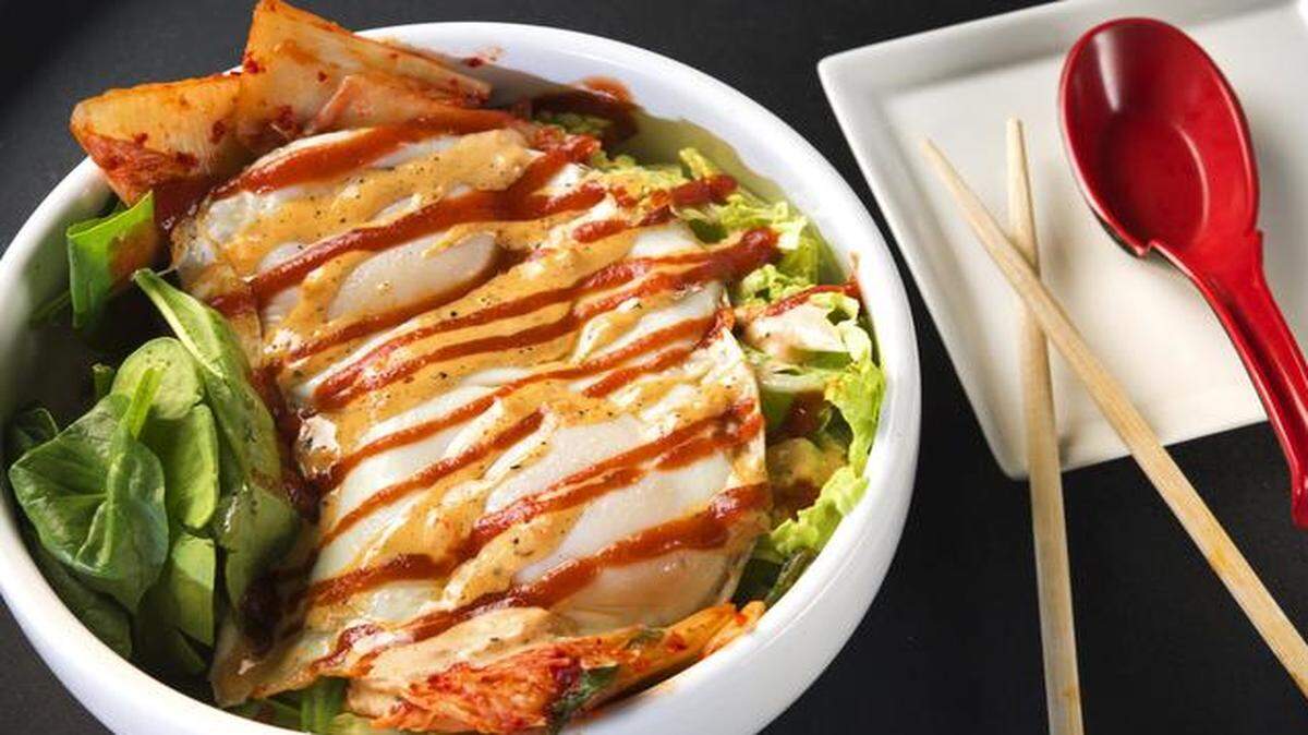 
Ramen Bowls in Lawrence serves a spicy chicken curry ramen topped with a Sriracha sauce.


