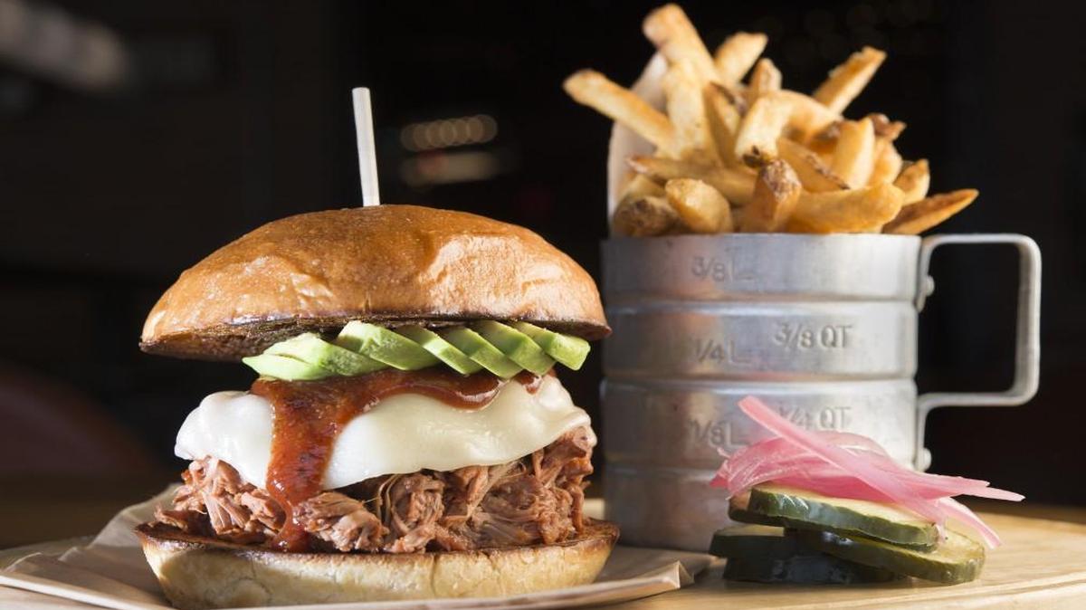 Smoked jackfruit mimics the taste and texture of pulled pork in Char Bar’s Jackknife sandwich, which also features melted provolone, avocado slices and fried jalapeño slivers on a soft egg bun.