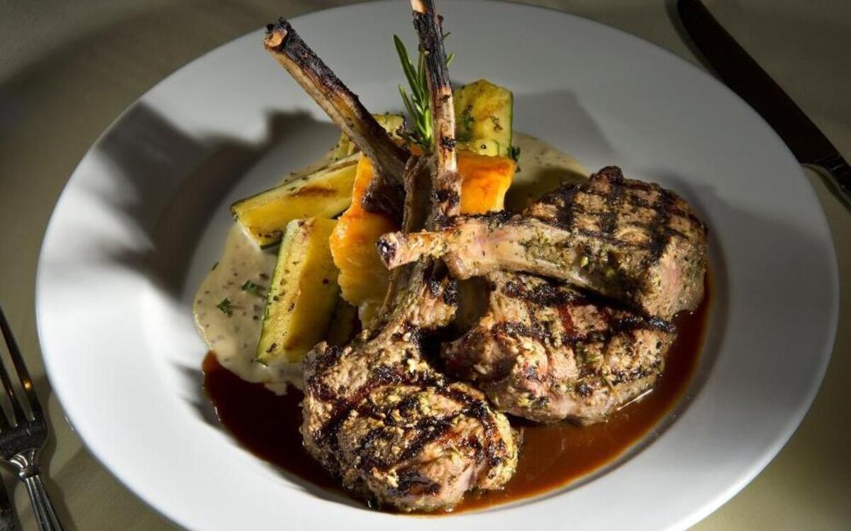 The rack of lamb at JJ’s is served with au gratin potato, zucchini, celery root, mustard Dijon cream and lamb demi-glace.