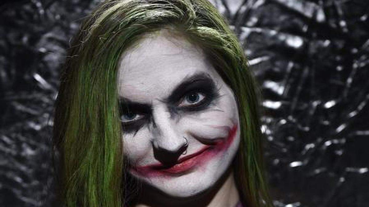 
Elsa Rhae Pageler of Overland Park is a makeup artist known for her elaborate face painting. By looking at images on the computer, Rhae transformed herself into The Joker last month inside her one-bedroom apartment.
