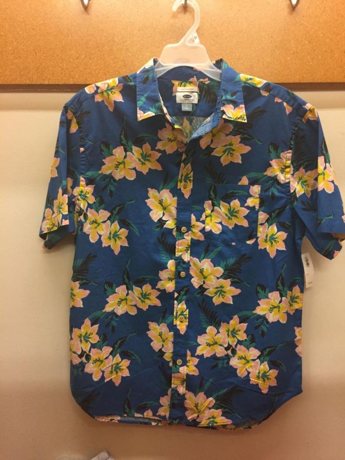 For a neighborhood barbecue, an updated Hawaiian shirt is a fun option. And don’t worry, a thoughtful pattern in flattering colors and a more tailored shape will prevent you from looking like Guy Fieri. This navy button-up with yellow and pink flowers is a great option ($26.94).