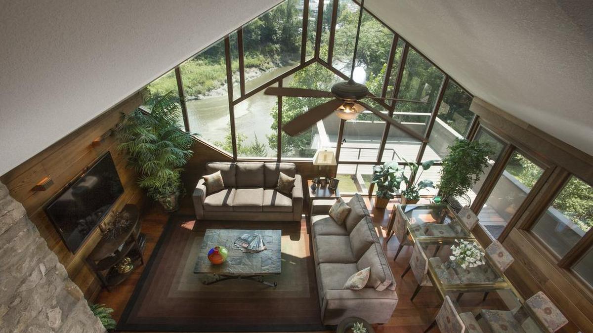 The great room, like the rest of the house, faces out onto nature.