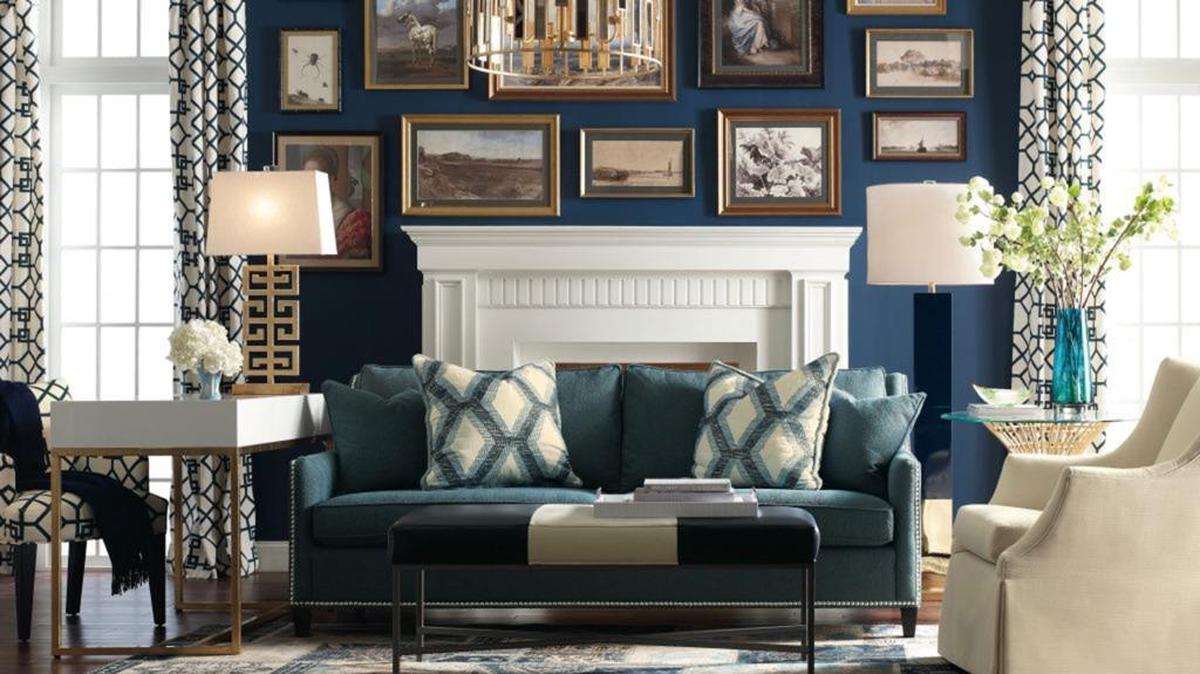 This room demonstrates the five essential ingredients of a well-dressed home: a wall color that sets the tone, interesting lighting fixtures, a mix of fabrics, well-chosen art and personal touches.