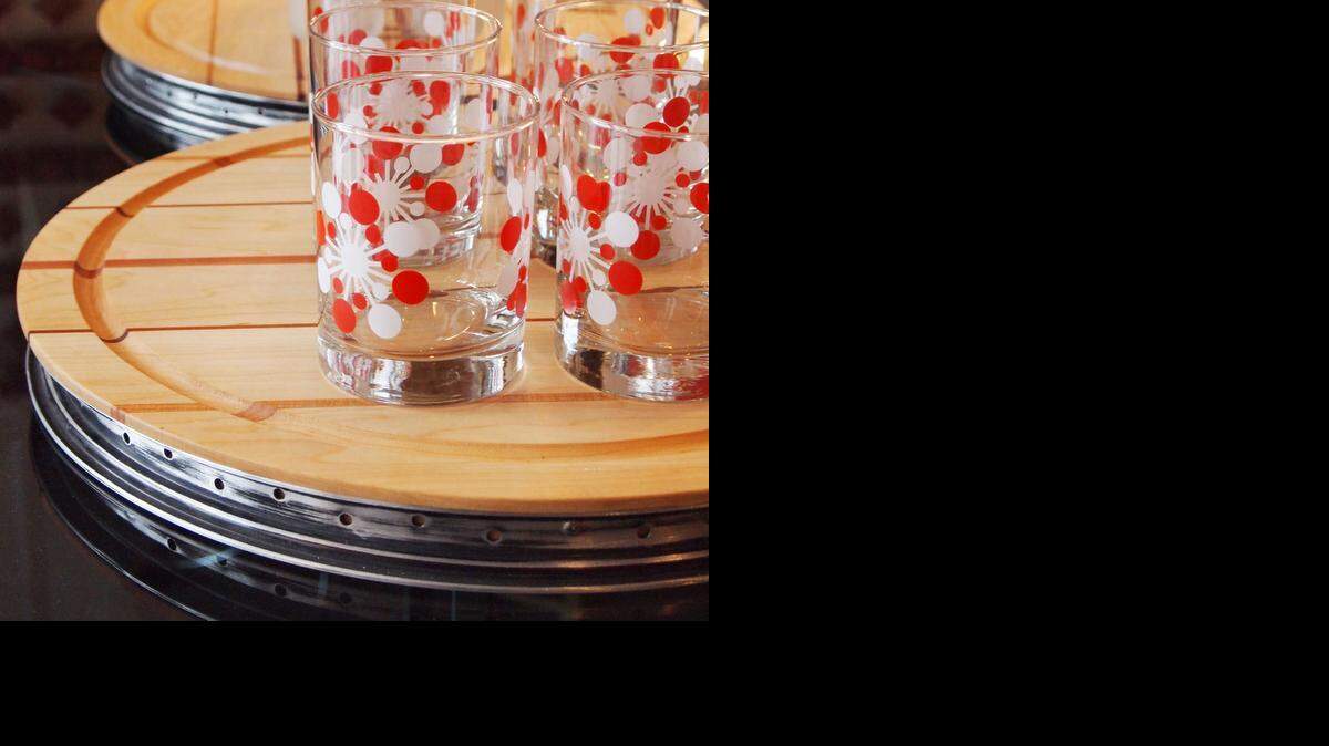 
Bicycle rims and salvaged wood become cutting boards from Solo Home Design. 
