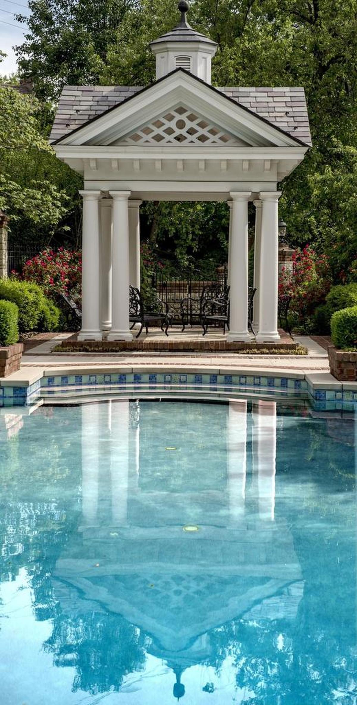 This Mission Hills mansion has a gazebo at the head of its fancy inground pool.