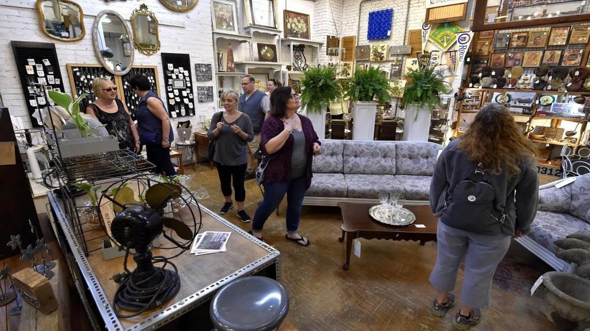 Shoppers browse the offerings at Good JuJu, one of the many West Bottoms venues that specializes in vintage and antique merchandise.