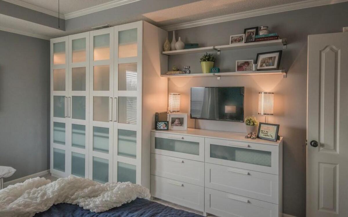 In addition to redoing the closet in Adriana and Matt Marble’s master bedroom, Stephanie Recupero, a designer with Ikea’s Home Tour squad, cleared clutter and created cohesiveness by replacing traditional bedroom dressers with a wardrobe with frosted glass and two chests that have cleaner lines and hold more stuff.