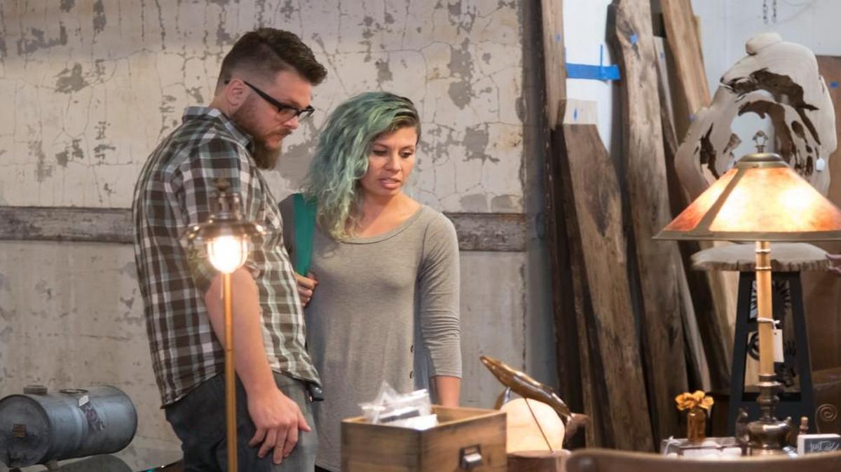 Sandi Devenny and Josh Dusel browsed at Bottoms Up Antiques in the West Bottoms on a recent First Friday weekend. The couple say they look for vintage and antique pieces that have simple lines that will blend with their decor.