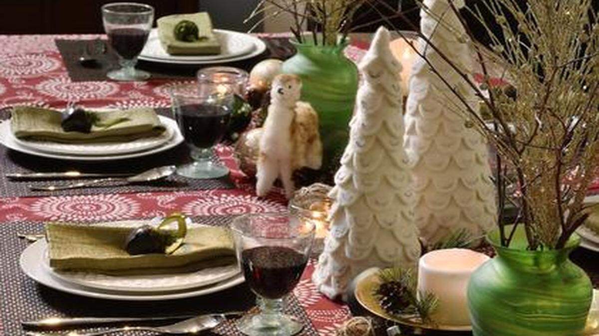 
Dress your holiday table and feel good about it. The green vases, goblets, tablecloth, Christmas trees and the fuzzy alpaca-like vicuna were made by artisans who will directly benefit from their purchase. 
