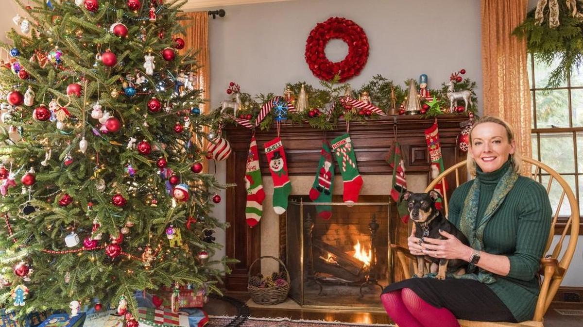 Lee Smithson Burd (with family dog Scooter) looks forward to Christmastime at her family’s home in Kansas City.