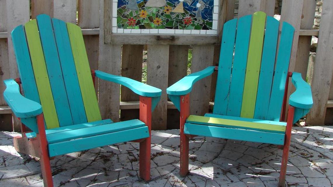 
I used leftover aqua chalky paint from the armoire on our wooden Adirondack chairs, then added neon green stripes — also chalky paint — for a punch of color. The chairs had been solid red.
