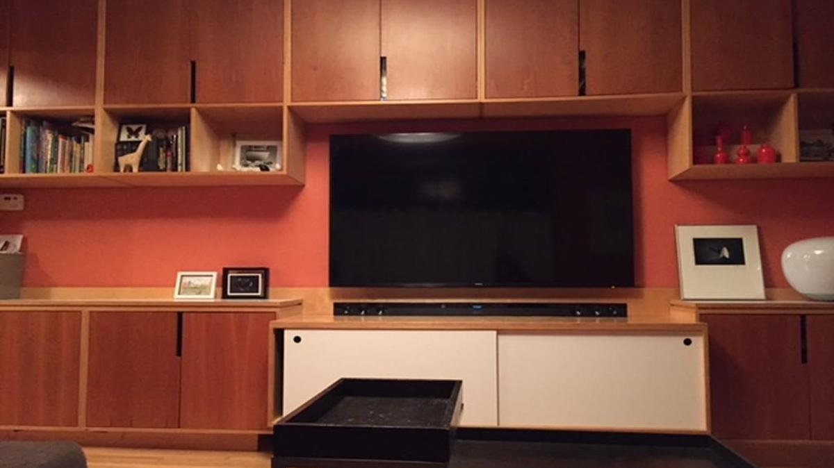 Dan Maginn put his architectural skills to work creating cabinetry that visually shrinks his 65-inch television.