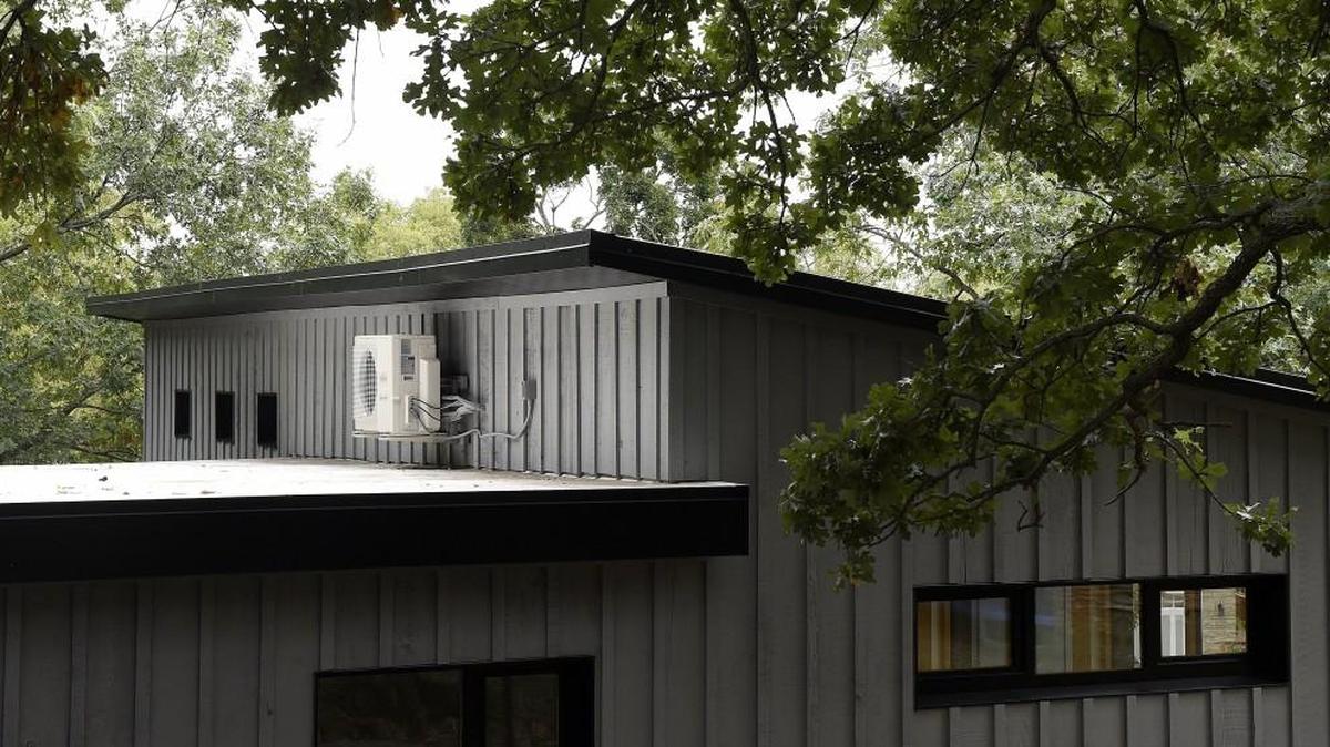 A mini split heat pump made by Fujitsu sits along the roof line above the living room on Tuesday of the remodeled energy efficient passive home on September 29, 2015 at Lake Quivira, Kan.
