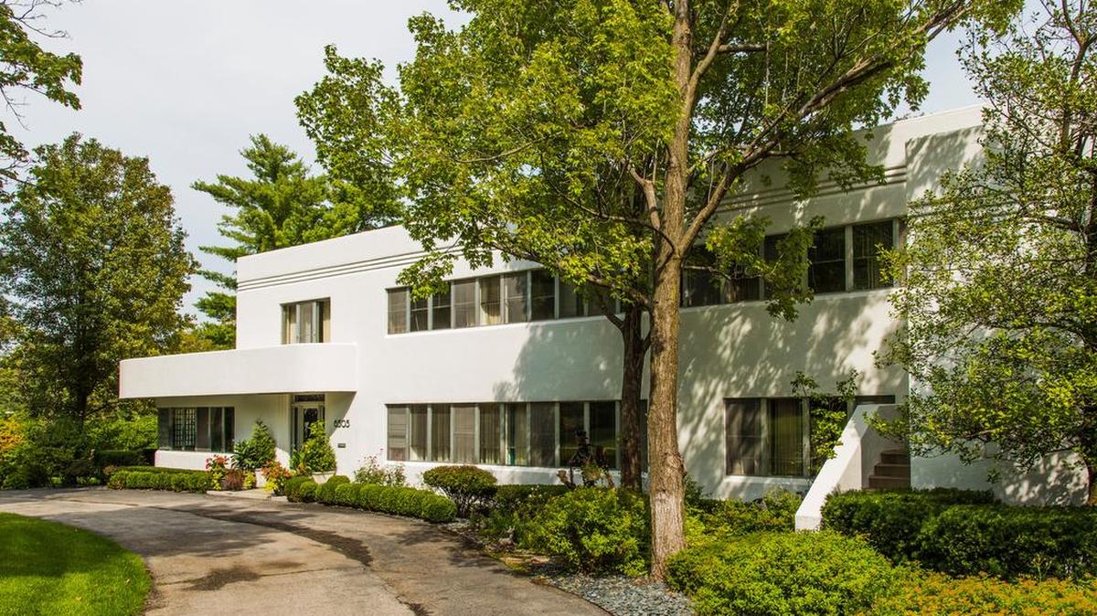 
The sleek, modern home with its low profile and contoured lines stands out from its more traditional neighbors on State Line Road.
