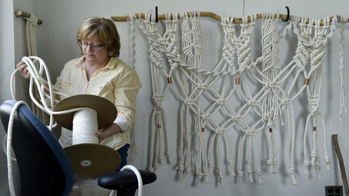 Barb Mizik of Leawood created a macramé wall hanging that incorporated a tree branch at a recent workshop taught by Hallmark photo stylist and macramé veteran Andy Newcom. Macramé, a craft staple of the 1970s, is trendy again, but this time around using updated materials that make it “cleaner, more graphic and simpler,” Newcom says.
