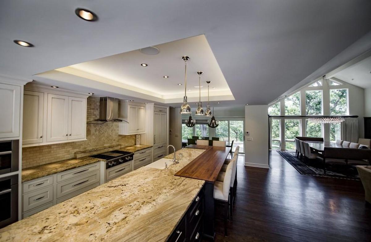 This 6,500 square foot mansion in Shawnee mansion has a kitchen island that’s more than 15 feet long.