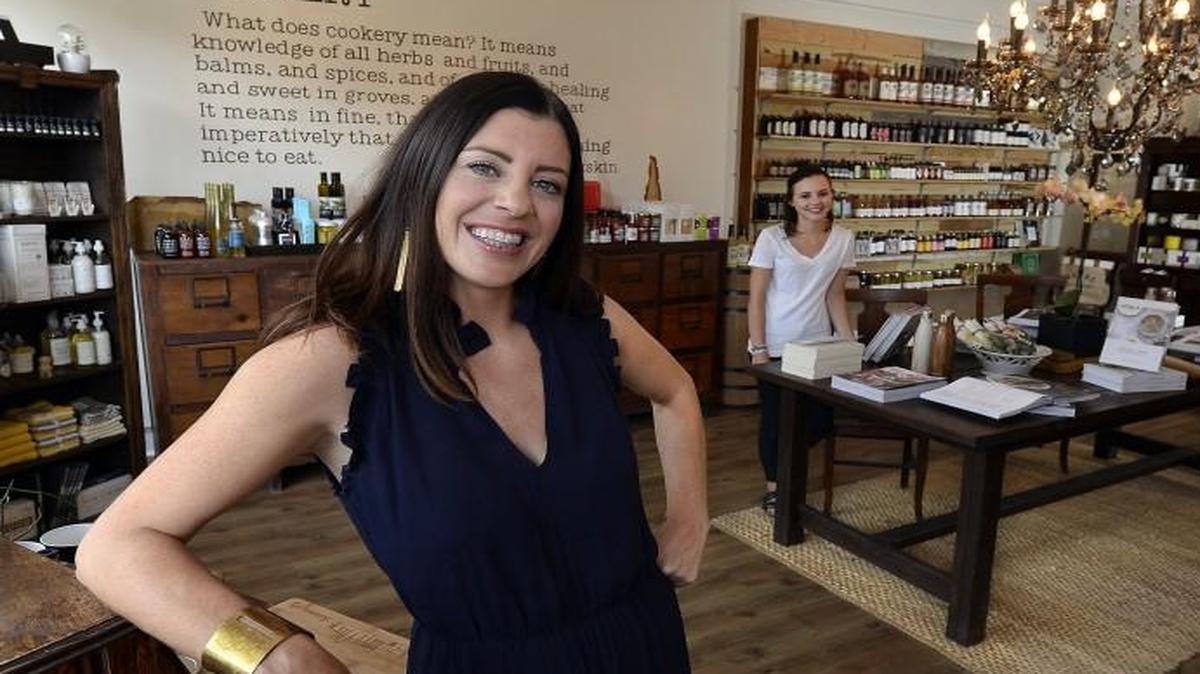 Season + Square owner Andrea Joseph loves her close-knit Brookside neighborhood and greets guests at the front door of her “modern mercantile.” Daughter Izabella, in the background, helps around the store when she’s home from college. The shop is at 6205 Oak St.