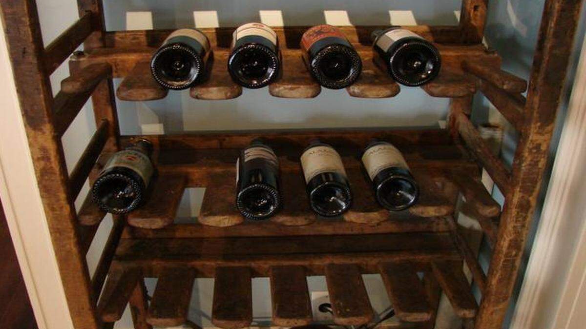
This antique cart sits in the Gregorian dining room. It was purchased at a yard sale several years ago for $80. It’s used as a wine rack now, but what was in originally intended for?
