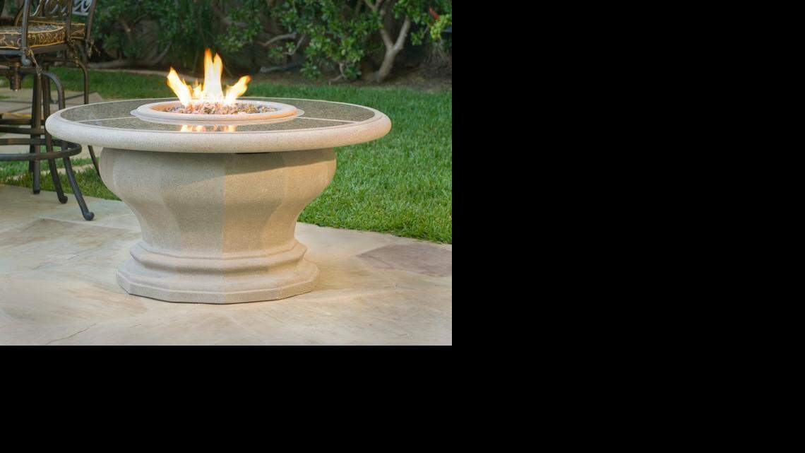 The flames on most fire tables including American Fyre Designs’ Inverted Firetable, shown here with a granite inset, are adjustable.
