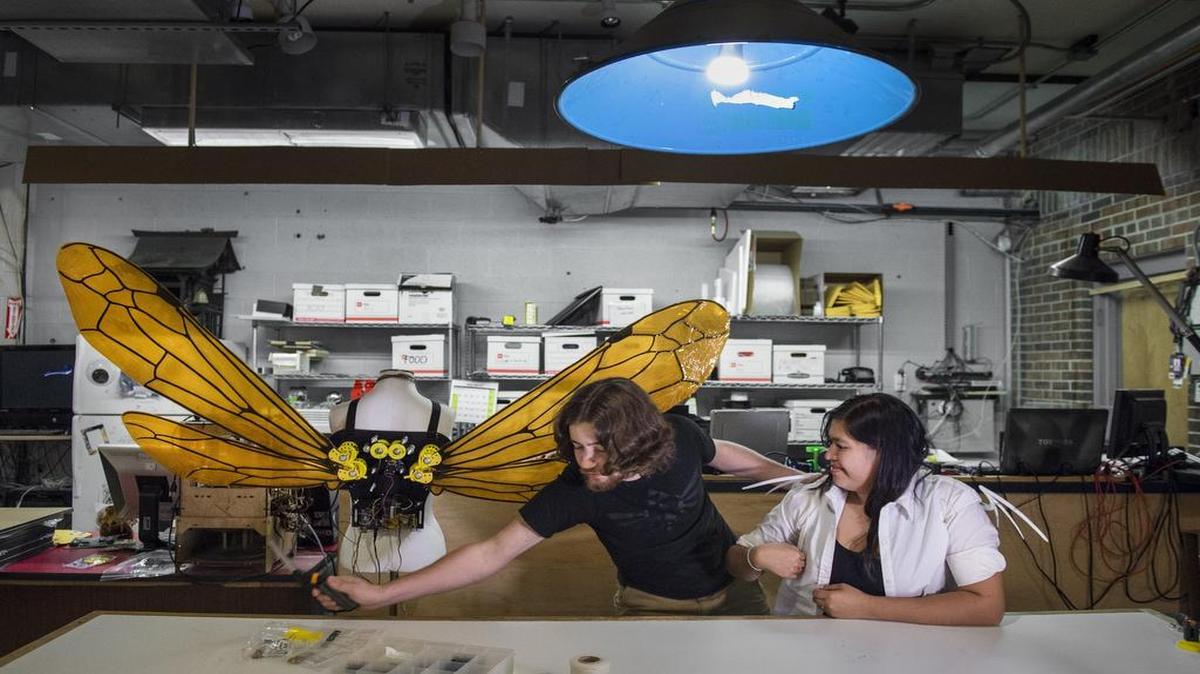 
At Hammerspace in Brookside, members pay a monthly fee for access to tools, machinery, work areas and others’ expertise. Jordie Smith, maker of electronic costume accessories, attached a pair of wings for costume designer Patricia Garcia. Both are from Kansas City, Kan.
