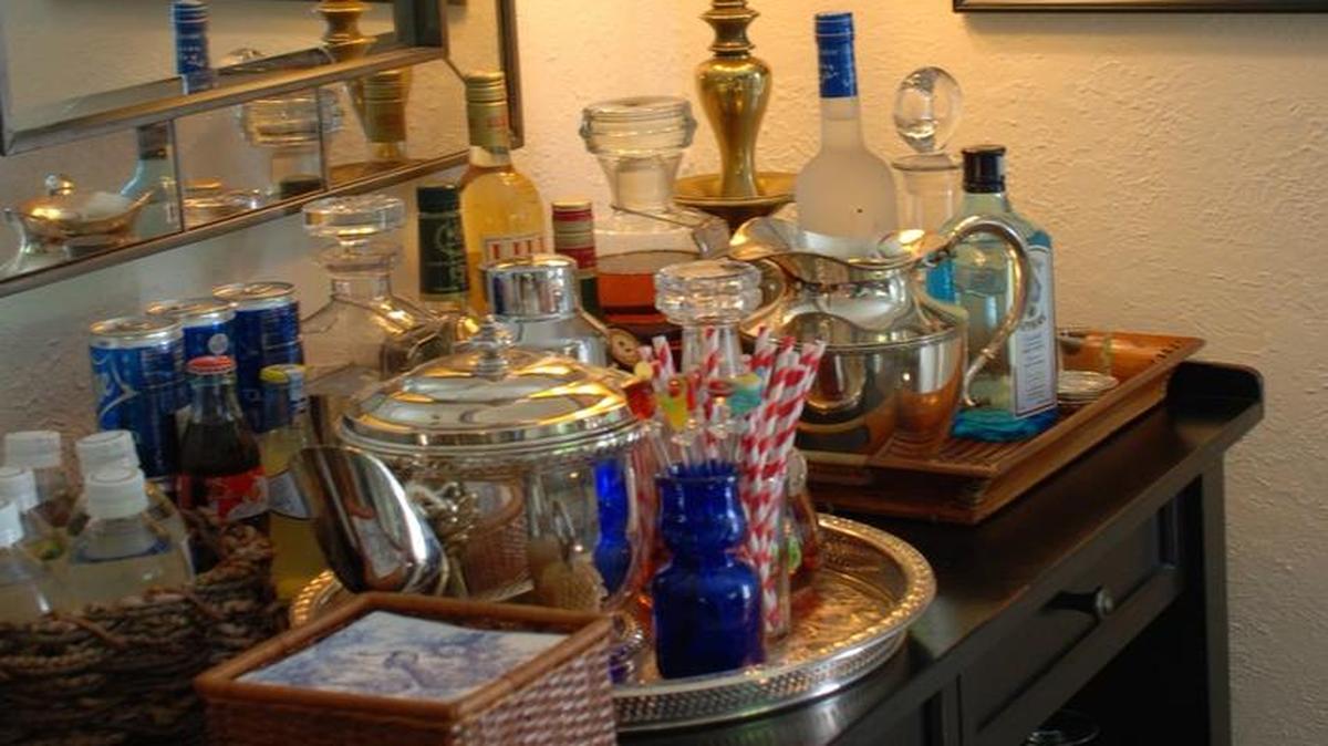
Approach styling your bar as you would any other display in your home, with an eye for details and drama. 
