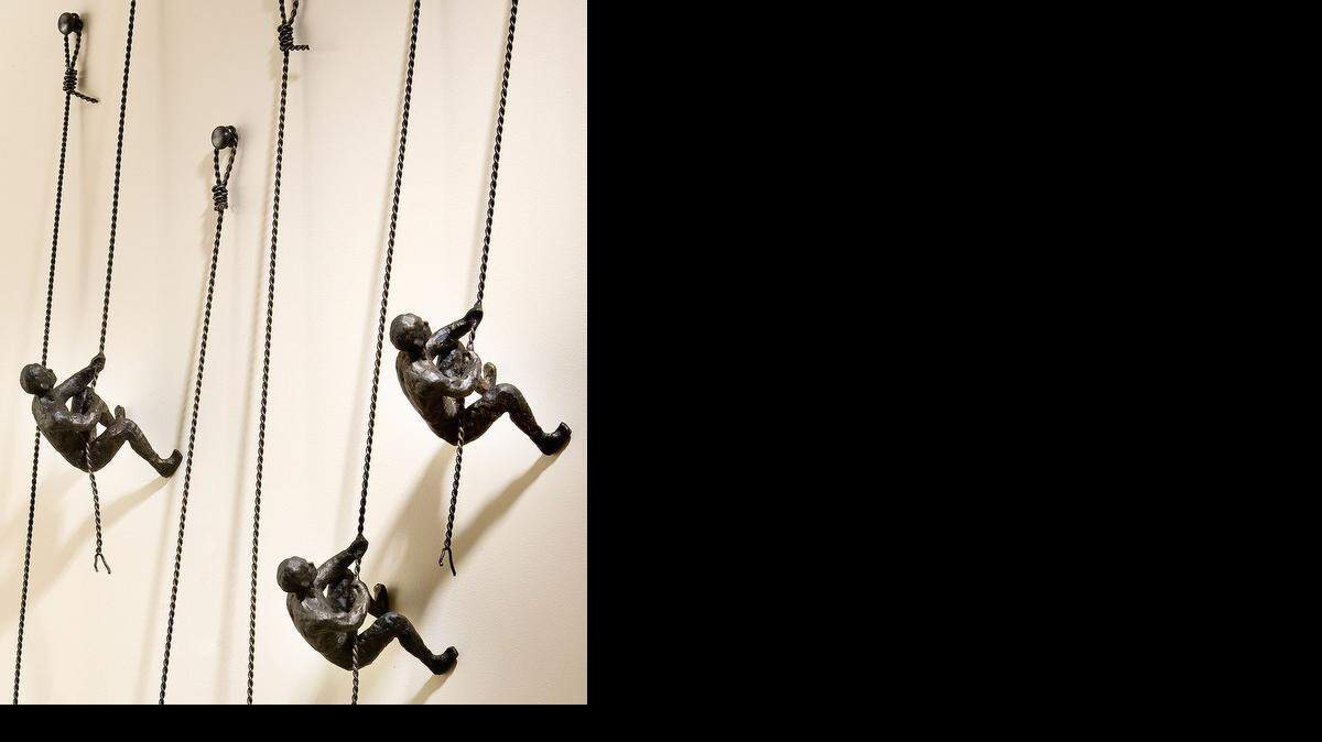 
Bliss Home and Design’s “Climbing Man” sculptures, (top) $98; Murray Feiss Hounslow large pendants (bottom) $229 at 1-800-Lighting.com; Zuo Era Sapphire 12-light ceiling lamp (right) for $485.97 at Wayfair.com.
