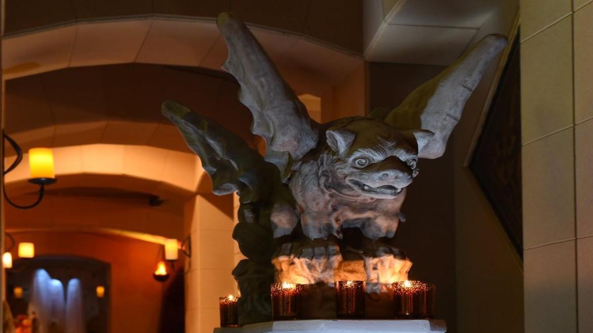 Don’t venture alone down this darkened hallway in Ray and Becky Ross’ Overland Park home, which features a dungeon-themed basement. Not with this gargoyle ready to pounce. The gargoyle came with the house. Votives courtesy of Aromatique.