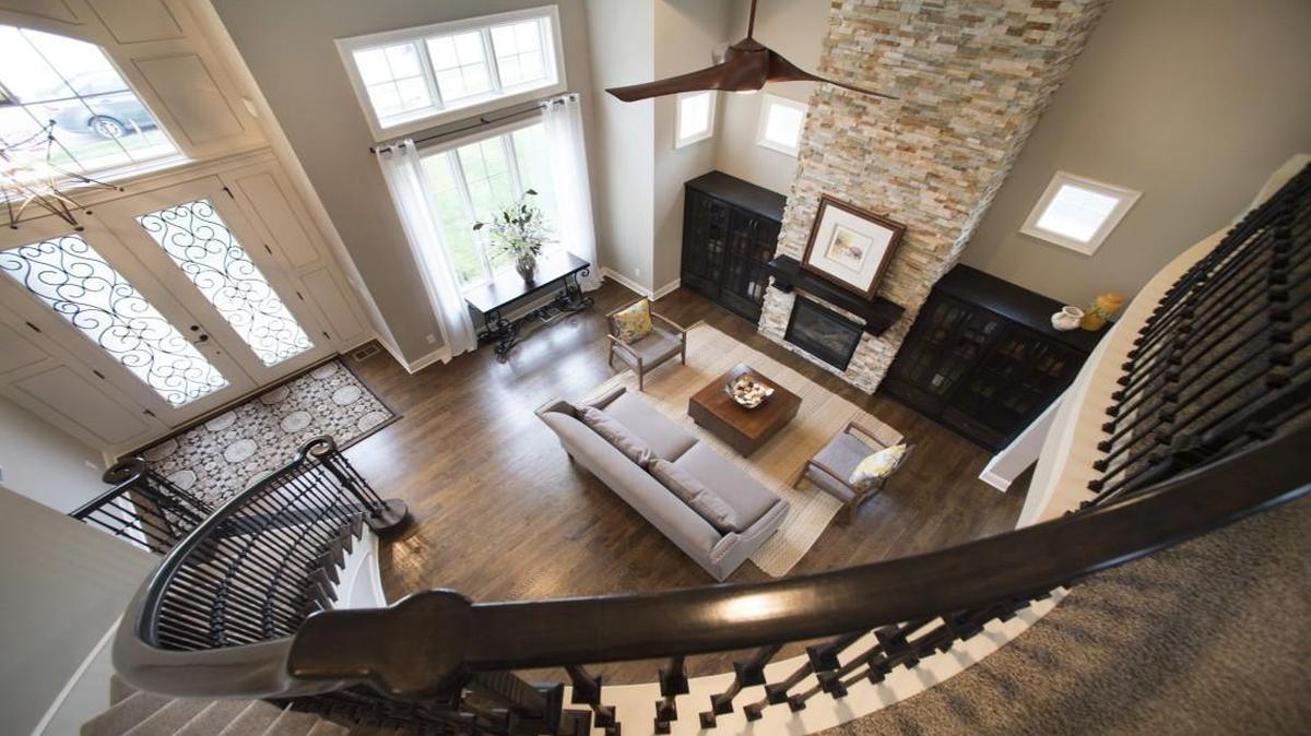 The entryway reveals the living room and the loft, important parts of the design in this Homes by Chris residence in the Copperleaf subdivision in Kansas City, North. This home will be shown in the Home Builders Association of Greater Kansas City Spring Parade of Homes 2016.