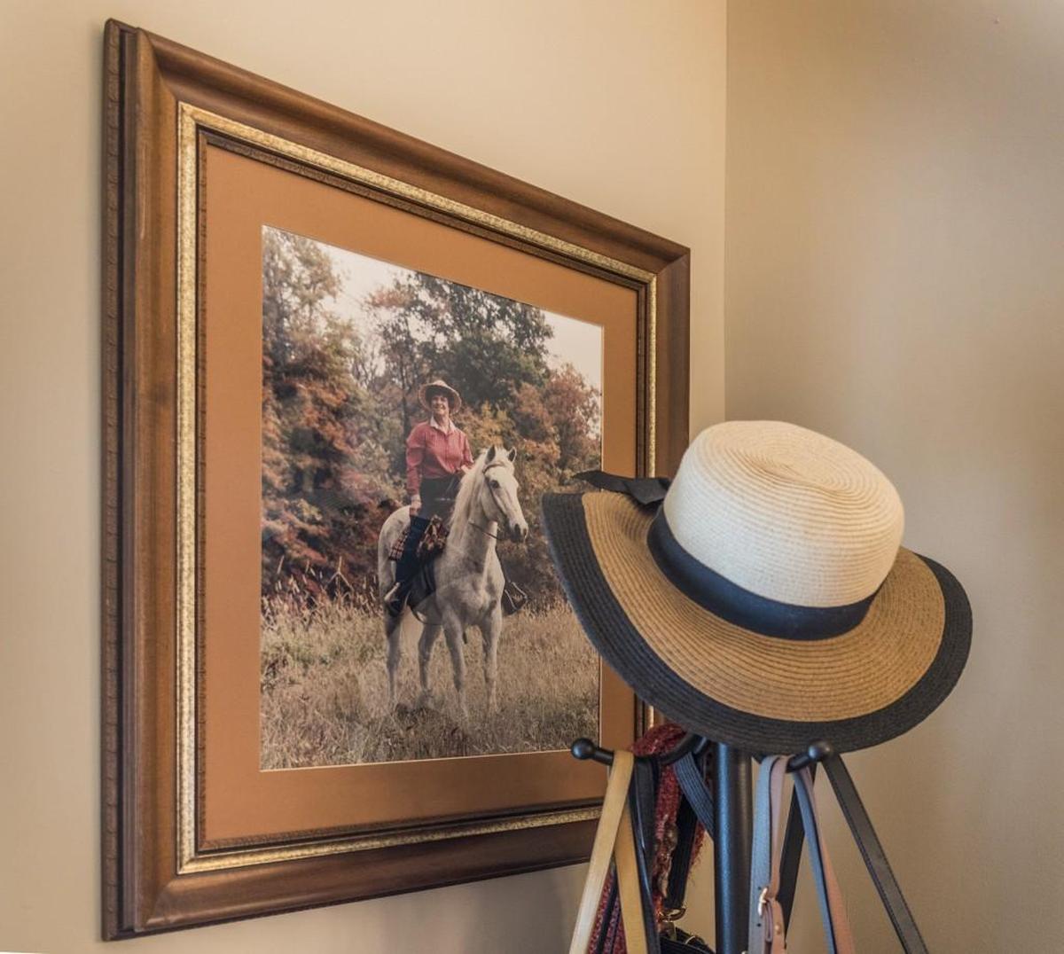 A large phtograph of Mary posing on a horse graces one wall of her bedroom.