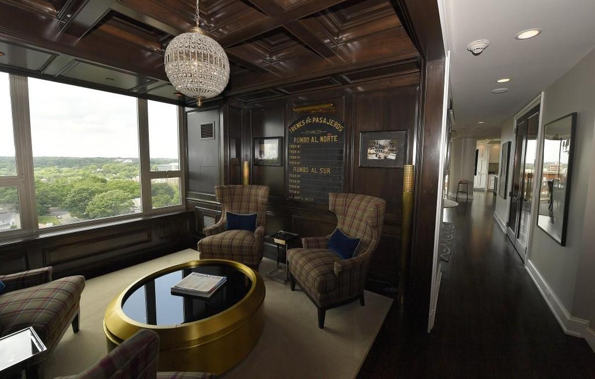 This condominium overlooking Loose Park and Country Club Plaza has a multi-million dollar mansion price tag and a stunning wood panelled library.