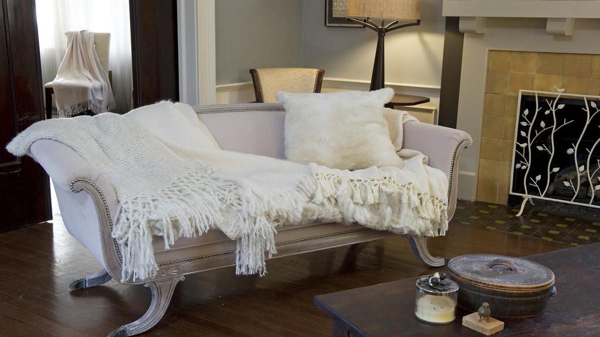 Bring ethereal fluffiness into the living room with throws and pillows, including Anthropologie’s lattice throw ($128), Restoration Hardware’s mohair throw ($149), World Market’s chunky chenille throw ($34.99) and Restoration Hardware’s faux fur pillow cover ($29). Yves Delorme’s cashmere Penelope opera throw from Terrasi Living ($495), is on a chair in the background.