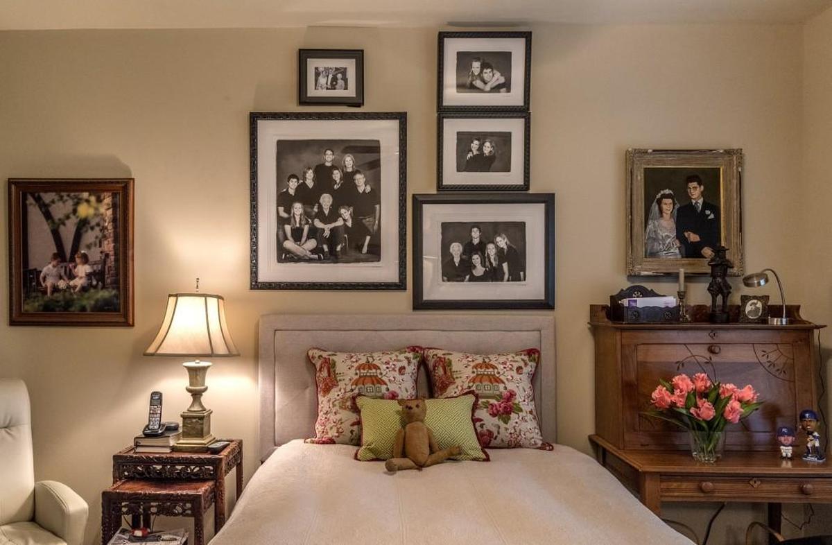 Family photos and a Teddy bear from the past decorate Mary Pogsonâ€™s bedroom.