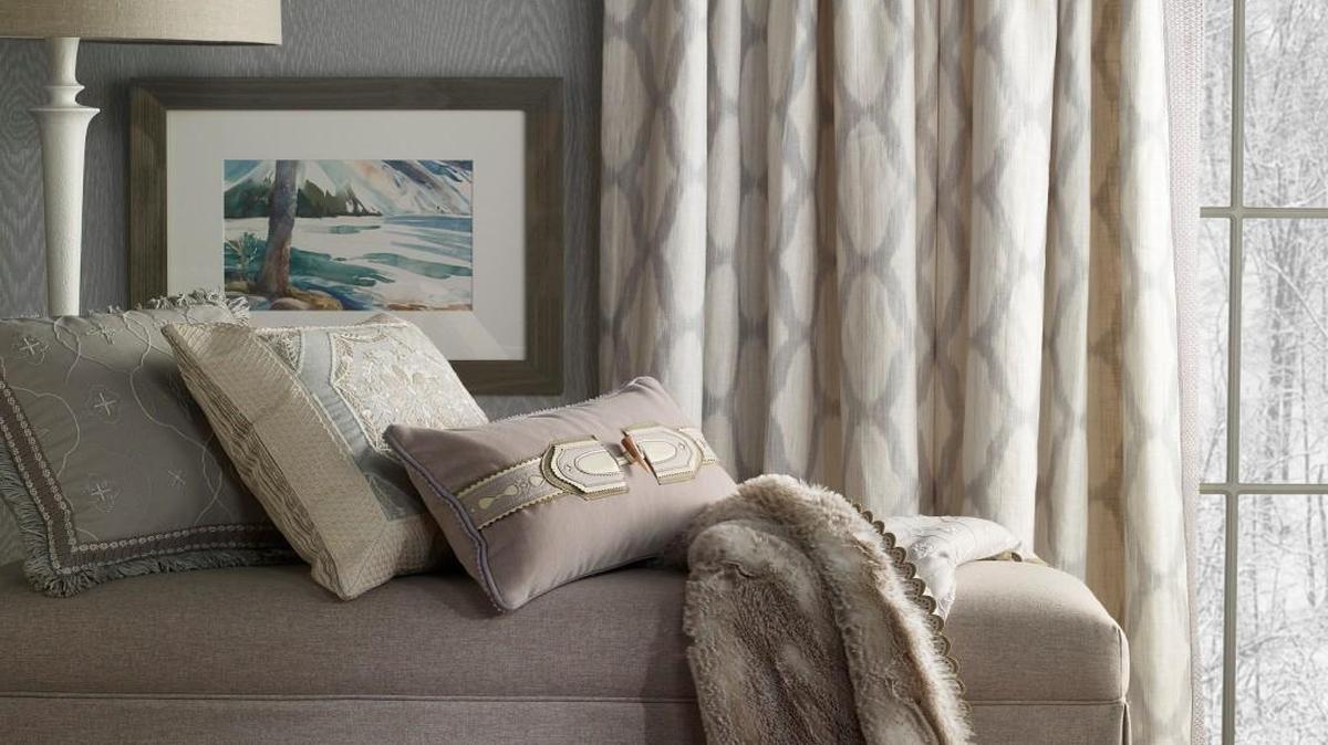 The Austrian Alps served as inspiration for designer Barbara Barry when she created the Chalet fabric and trim collection for Kravet Couture. The embroidered fabric on the pillows are Dirndl in Snow Mist (from left), Alpenrose in Silver Grey and Animalia in Sterling.