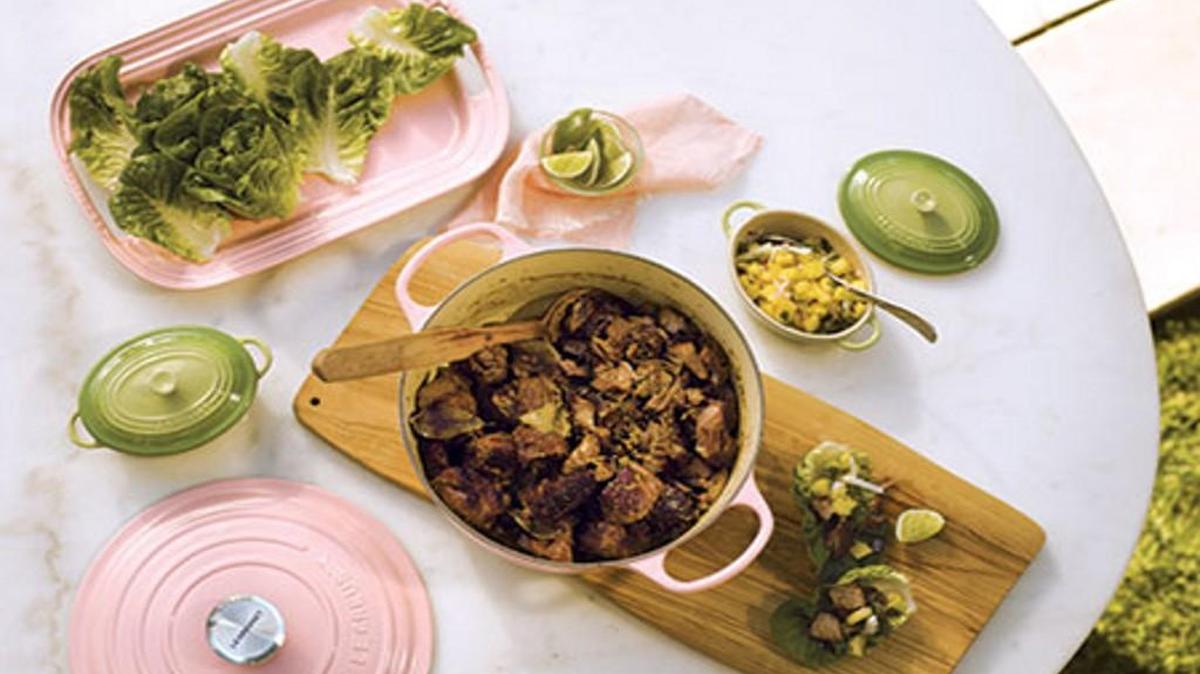 Le Creuset’s enameled ironware now comes in Hibiscus (pictured) as well as Pink Quartz and Serenity (blue), Pantone’s colors of the year.