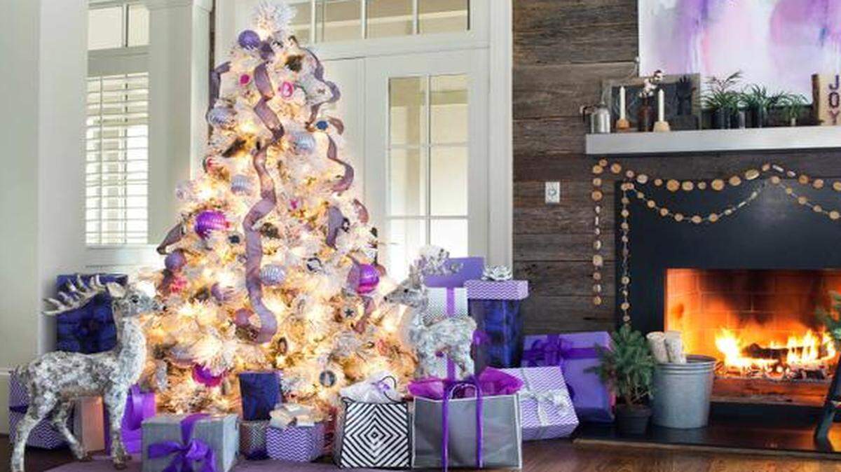 
Brian Patrick Flynn is a fan of flocked artificial trees, because the white flocking tones down the vivid green of the trees, making them fit more effortlessly with any color scheme.


