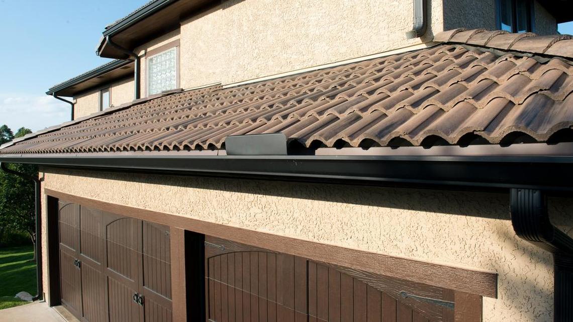 An Overland Park home features a suede-color concrete tile roof.
