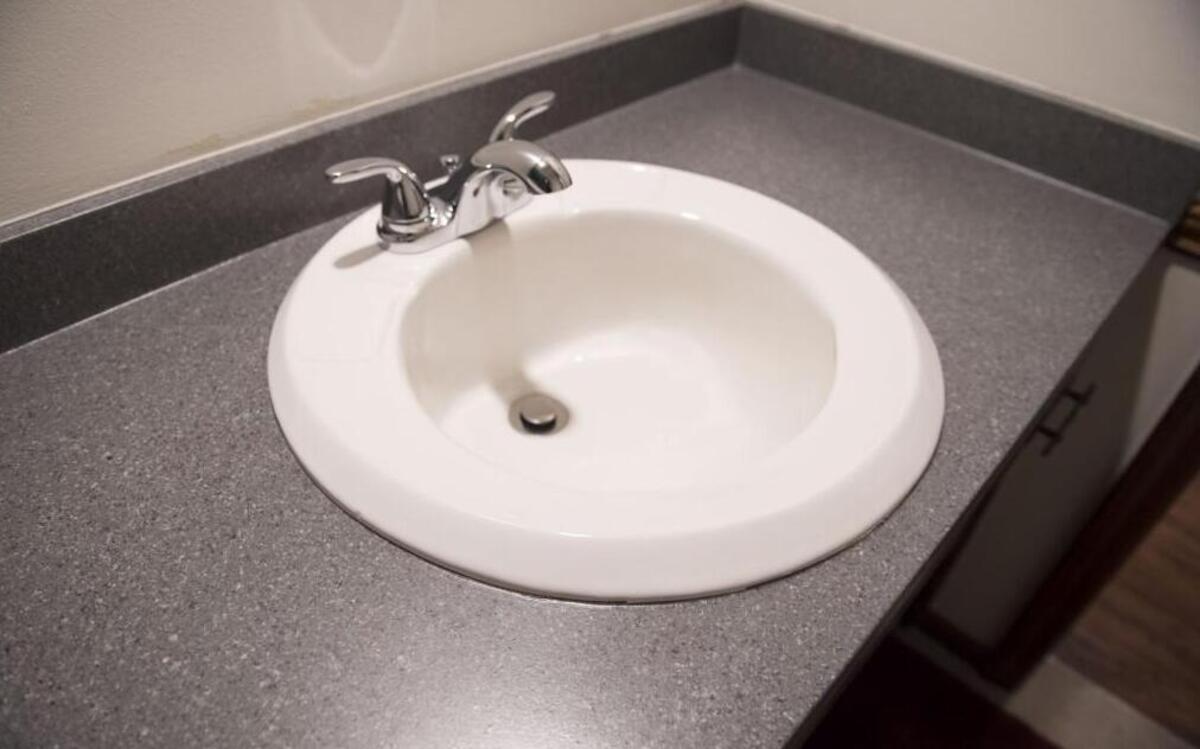 Dan Miller chose a dark gray granite finish for his countertops. The refinishing material comes in a vast array of colors.