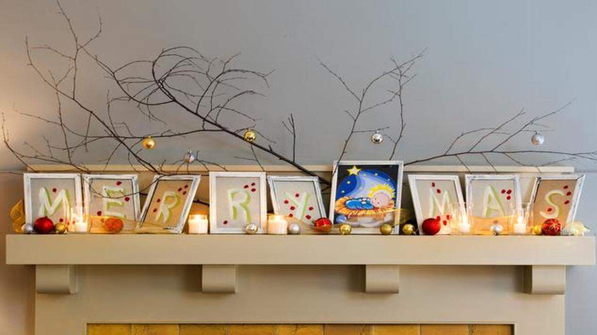 
House+Home Editor Cynthia Billhartz Gregorian came in under budget by reverse painting a festive yet whimsical message onto picture frames that cost $1 each.
