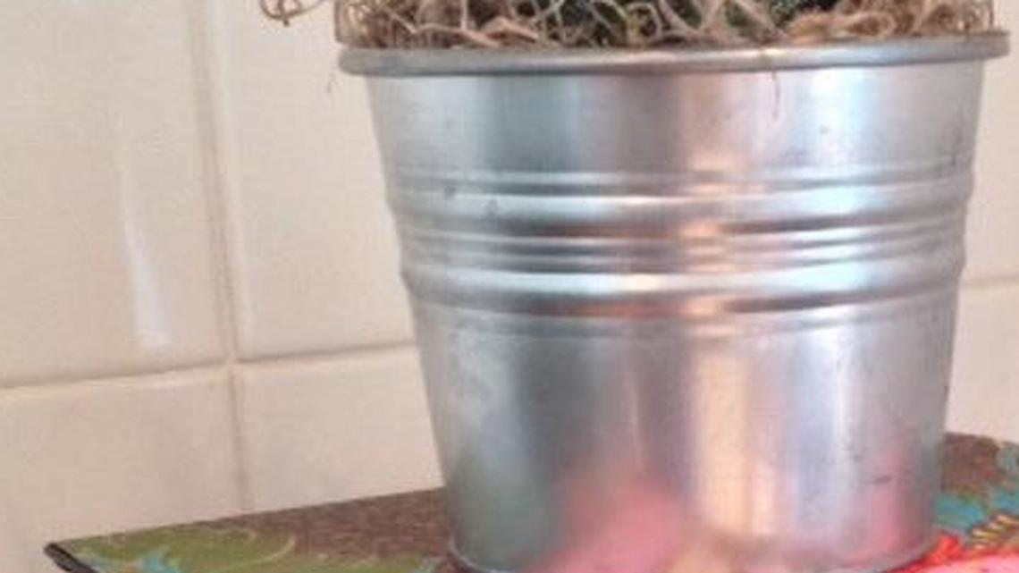 
Stacking books covered with the handmade paper makes for a bright and pretty pedestal for picture frames, candles and plants.
