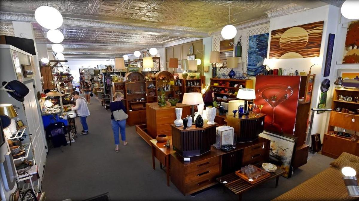 Customers browsed the upper floor of Urban Mining Vintage in Midtown on a First Friday. In addition to midcentury modern furnishings, the flea market is known for its original artwork.