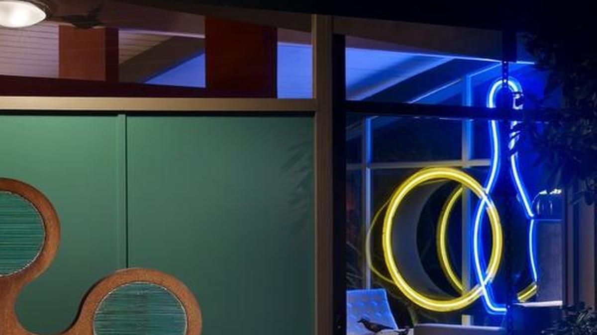 An 8-foot-tall neon bowling-alley sign is the hallmark of this home in the Enatai neighborhood of Bellevue, Wash. Hilary Young of Hilary Young Design Associates worked with the homeowner’s collection of artwork to inject color, fun and new life into his 3,500-square-foot home, including “Cinco,” by Seattle sculptor Troy Pillow, at the entryway.