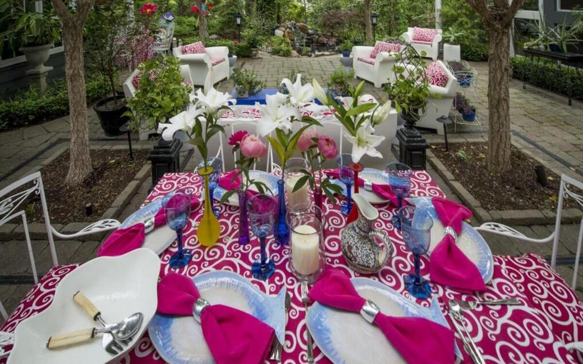 The Hills Are Alive garden in Mission Hills is set for a dinner party with bright splashes of color. The homeowner created this table-setting, but Trapp & Co. will set it for the Entertaining Gardens tour.