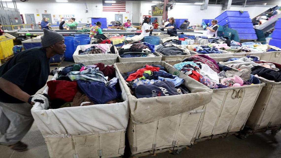 At a Goodwill plant in South Bend, Ind., bins of clothing are sorted and processed. Some of the items will go for resale, but much of the clothing will be bundled and sold for rags. Recycling helps keep textiles out of landfills.