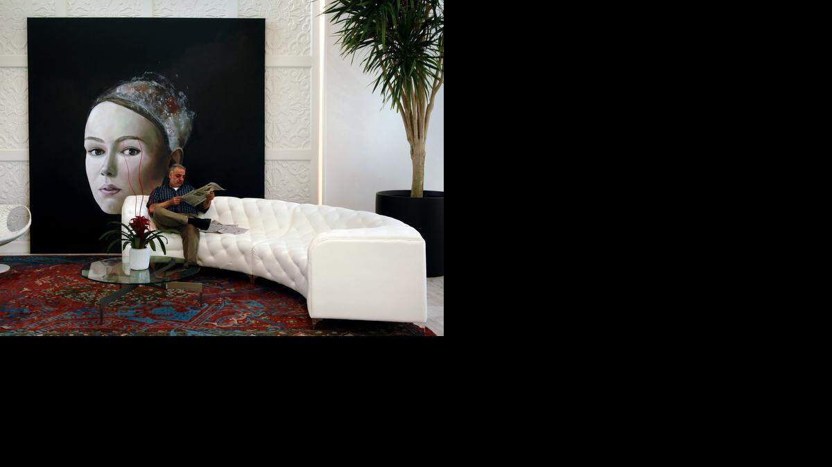 
A centerpiece of the Hotel Sorella’s lobby is a painting by artist Sarah Atkinson of North Carolina. The work was commissioned by the hotel. The white sofa is a custom piece by Samuelson Furniture. 



