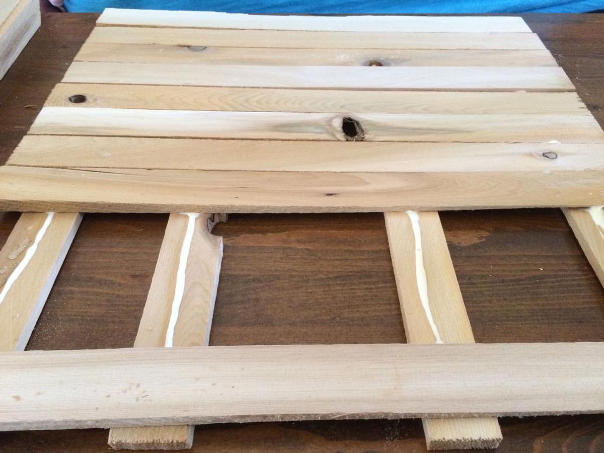 Coat four shims with glue, then place other shims on top.
