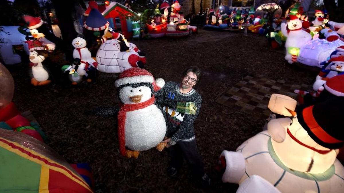 Paul Craig decorates the yard of his Olathe home with more than 100 inflatables in a display his neighbors call Paulie’s Penguin Playground.