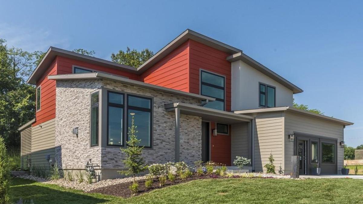 The houses at Urban North are gray and blue with pops of red, yellow, chartreuse and turquoise.