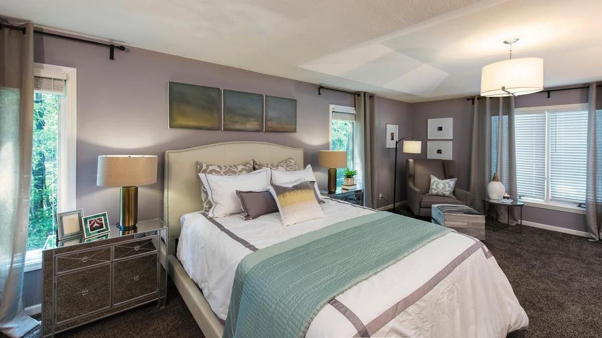 
Mary and Deric Mason’s master bedroom underwent a $10,000 Ace Hardware makeover that began with the eggplant-tinged wall color Town Square.

