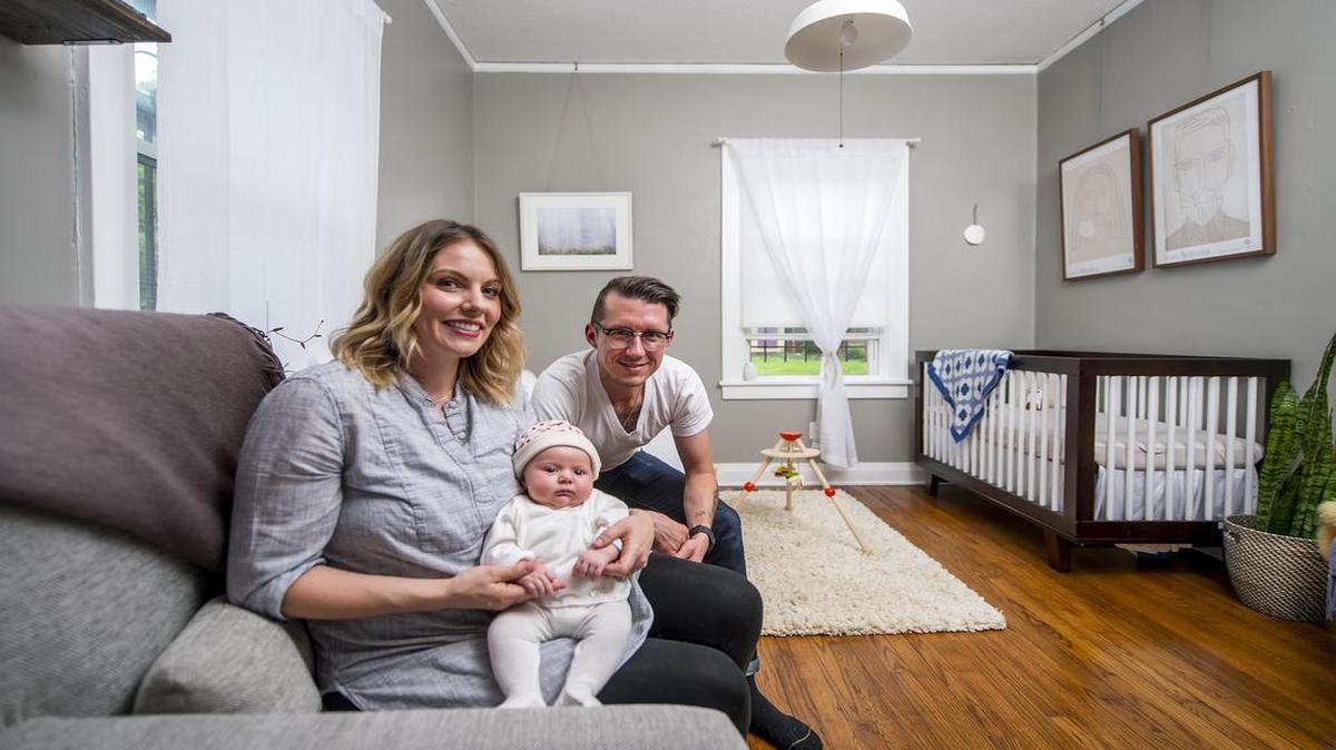 
Cristin Llewellyn, husband Christopher Ciesiel and baby Maeve sit in their new nursery inside their South Hyde Park home.
